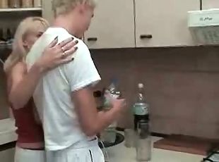 Russian blonde mom and son at kitchen