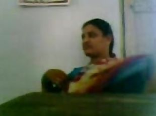 South indian school teacher with her collauge in staffroom