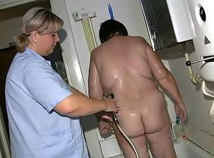 Granny gets a bath from her nurse